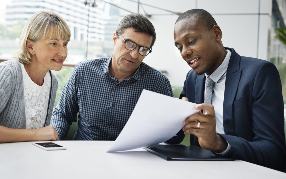 mature couple meeting with an insurance agent