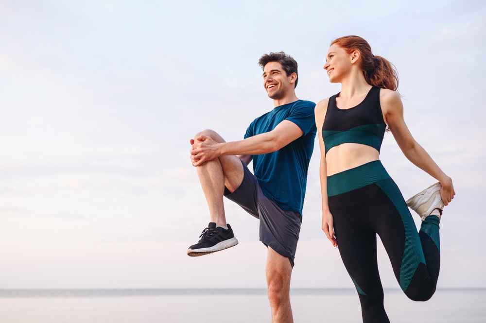 runners stretching outside