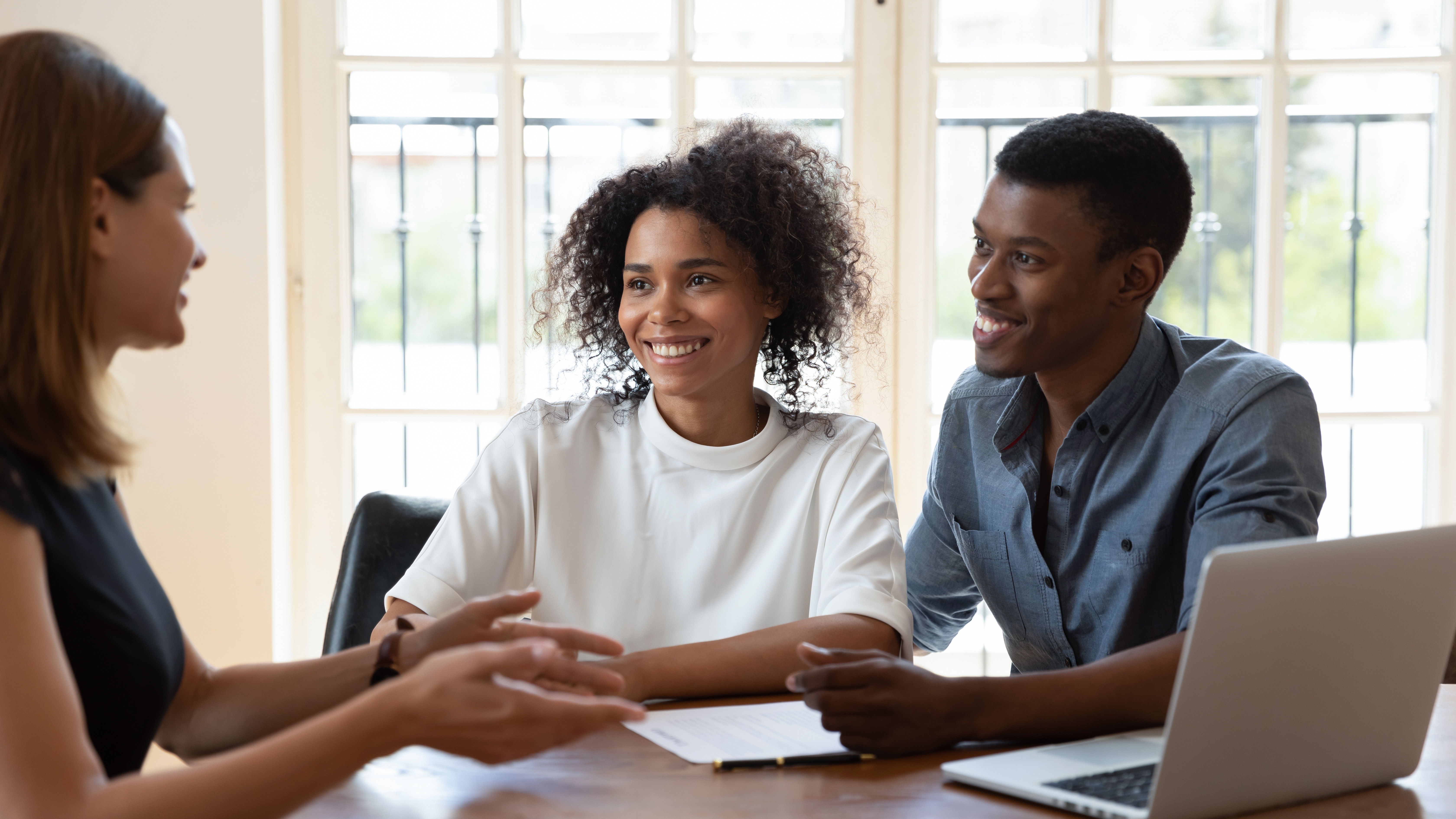 image of a couple talking with there insurance agent