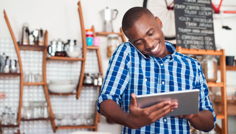 small business owner on the phone and tablet