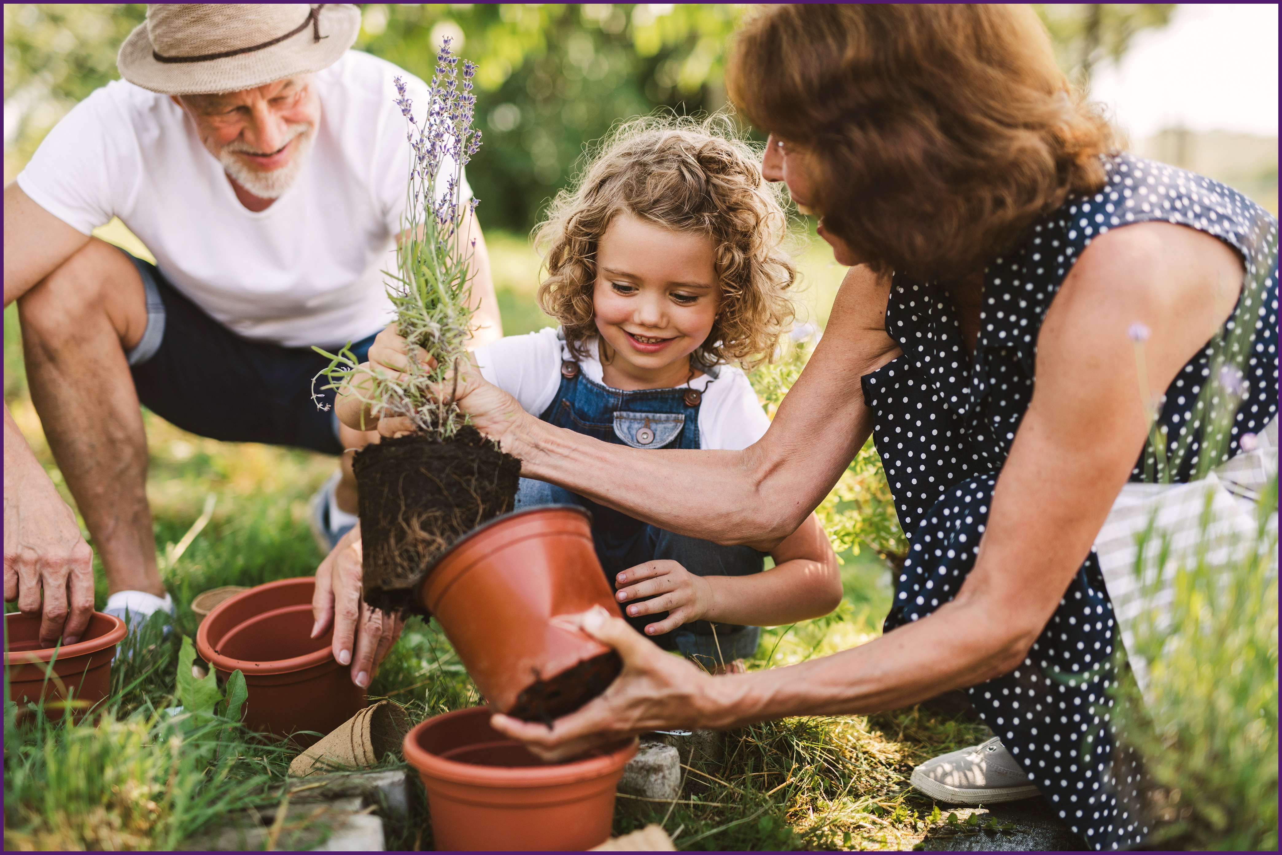 creating-a-legacy-2-ol image of a family outside potting plants