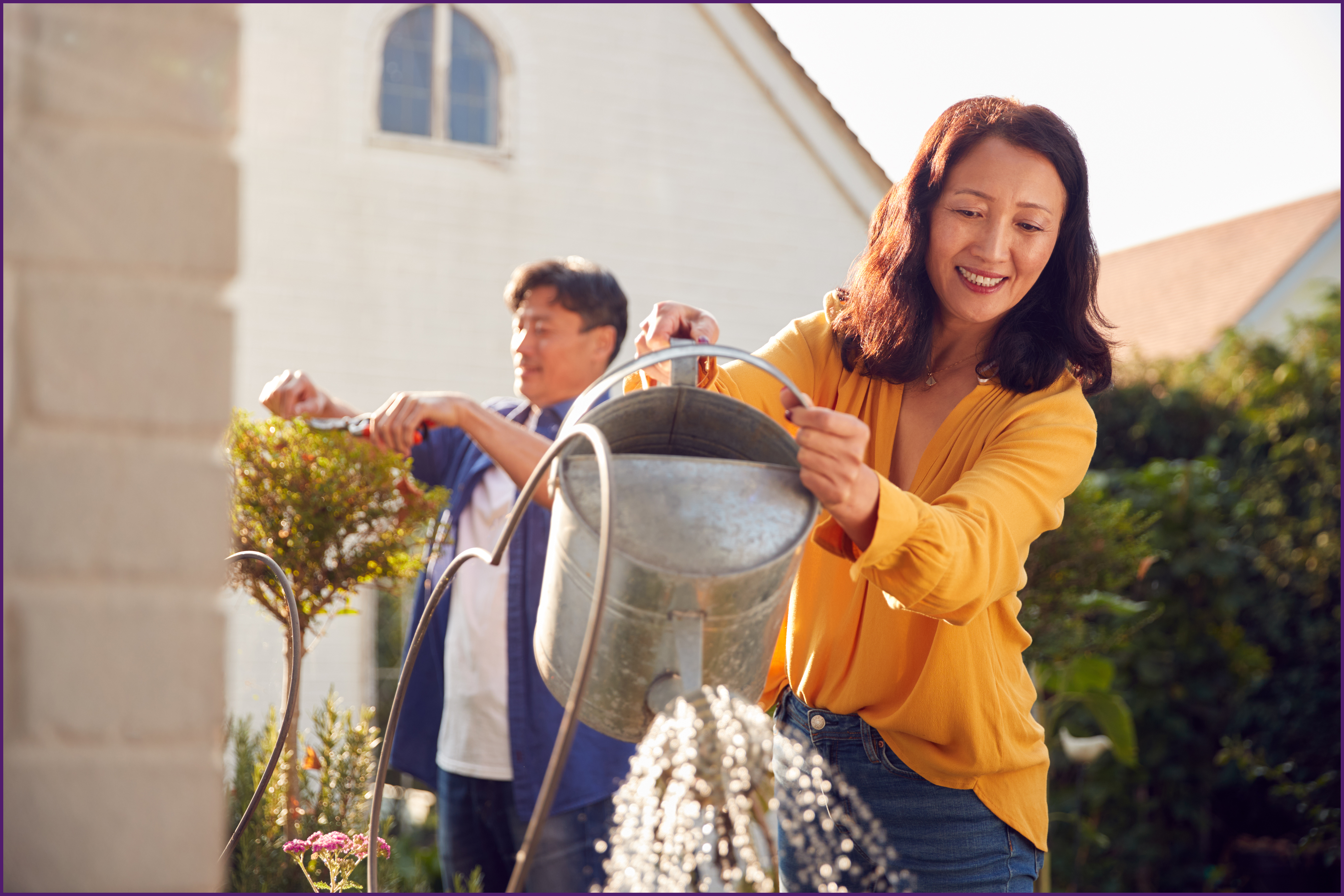 empty-nester-3-ol image of a couple outside doing lawn care
