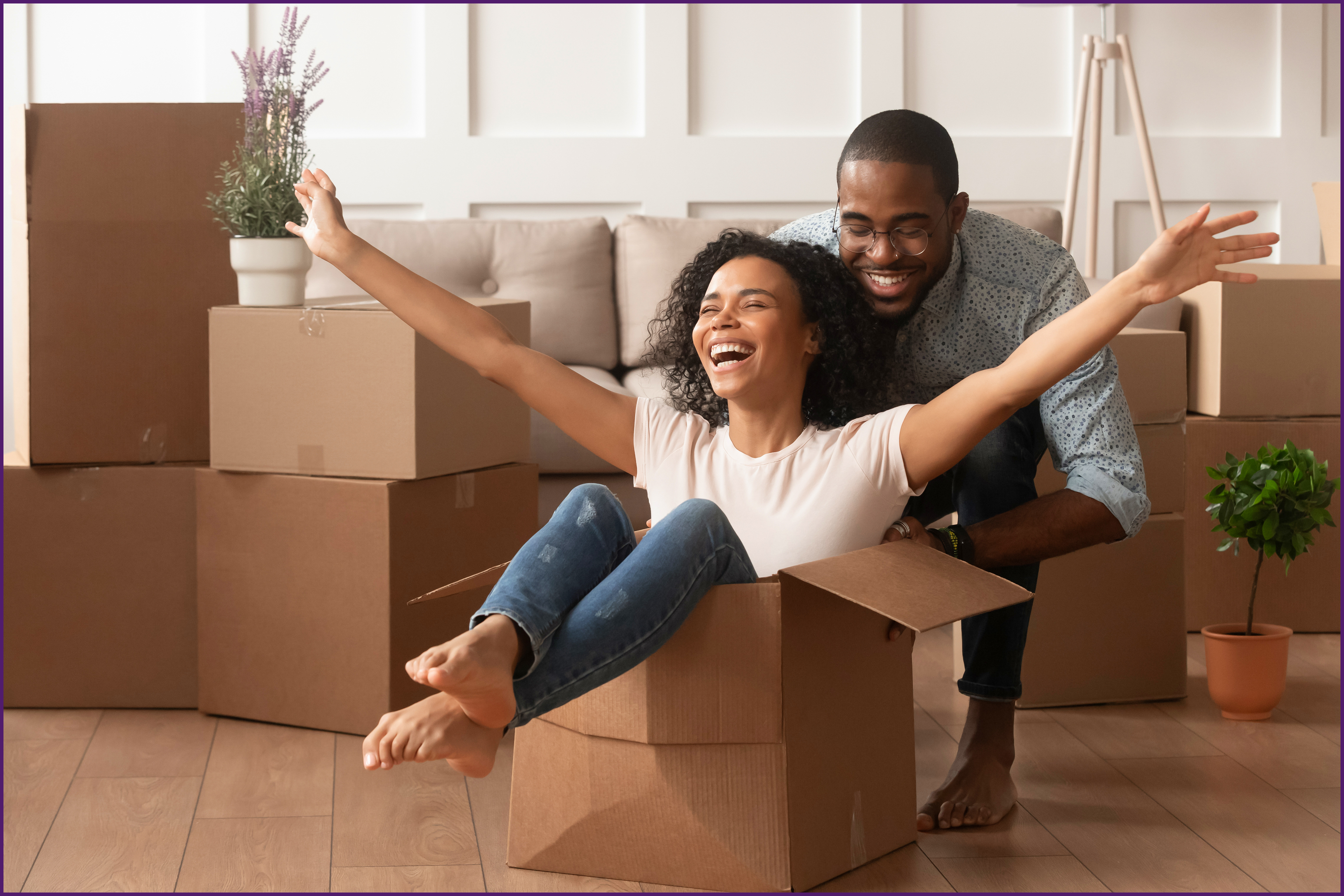 new-homeowner-3-ol image of a couple playing with moving boxes