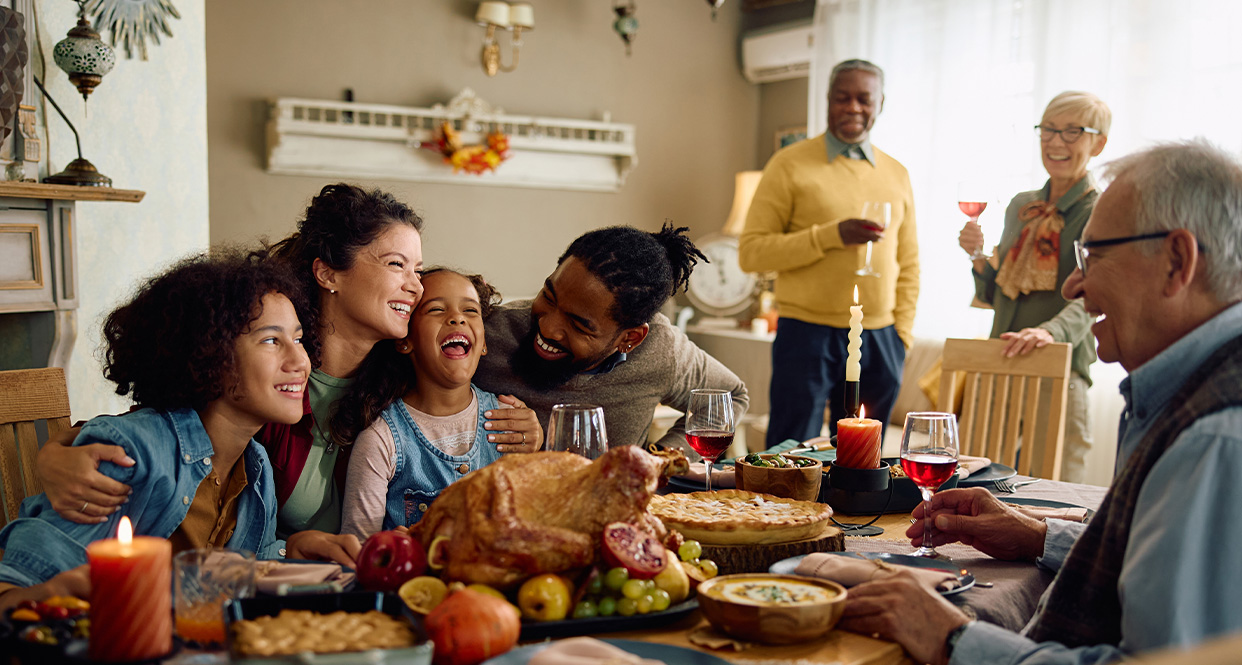 image of a blended family sitting at the dinner table