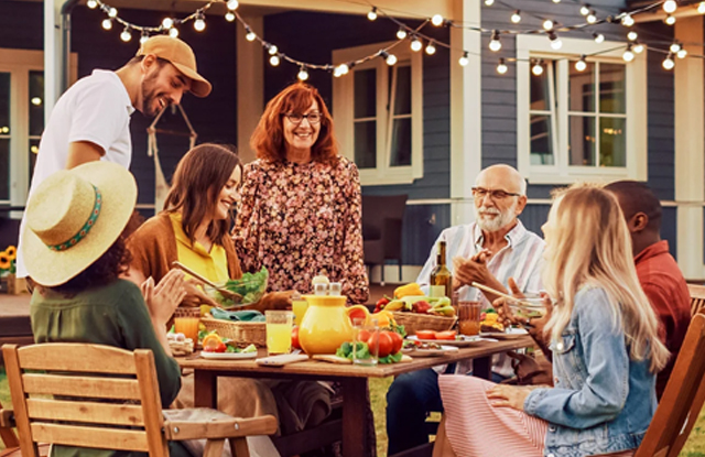 family outdoor eating a meal