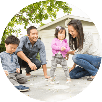image of a family outside playing with the children